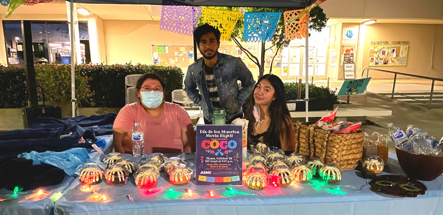 Members of the Associated Students pose during a Dia de los Muertos movie night in October 2021.